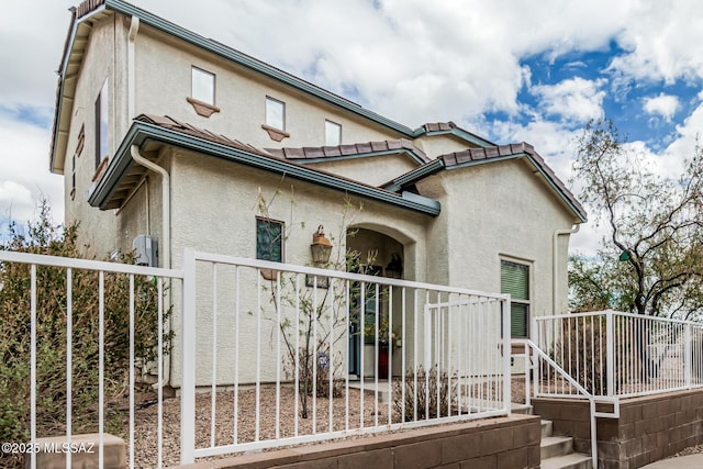 10560 E Forest Falls Ct, Tucson, AZ 85747 - view of property exterior with stucco siding