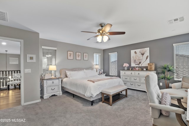 3443 W Tailfeather Dr, Marana, AZ 85658 - carpeted bedroom with ceiling fan and baseboards