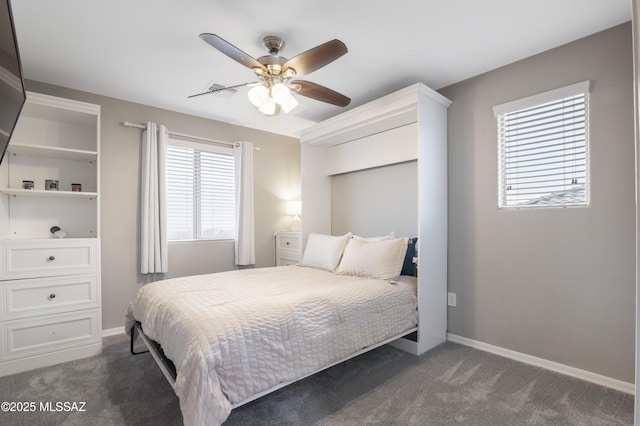 3443 W Tailfeather Dr, Marana, AZ 85658 - bedroom with dark colored carpet, baseboards, and a ceiling fan