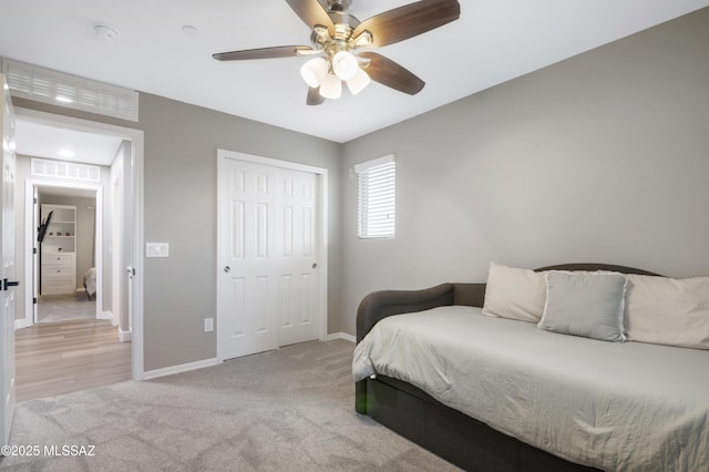 3443 W Tailfeather Dr, Marana, AZ 85658 - bedroom featuring carpet floors, baseboards, a closet, and ceiling fan