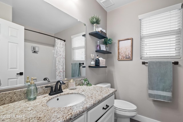 3443 W Tailfeather Dr, Marana, AZ 85658 - full bath with toilet, vanity, baseboards, and a shower with shower curtain