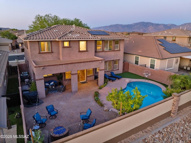 3443 W Tailfeather Dr, Marana, AZ 85658 - view of swimming pool featuring a patio area, a fenced backyard, and a mountain view