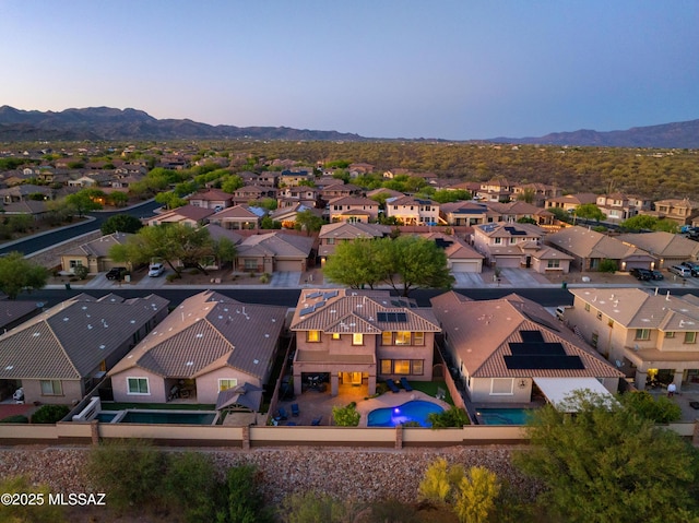 3443 W Tailfeather Dr, Marana, AZ 85658 - aerial view at dusk of view of pool, a residential view, and a mountain view