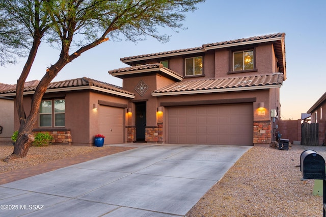 3443 W Tailfeather Dr, Marana, AZ 85658 - mediterranean / spanish-style home featuring stone siding, driveway, stucco siding, and a tile roof