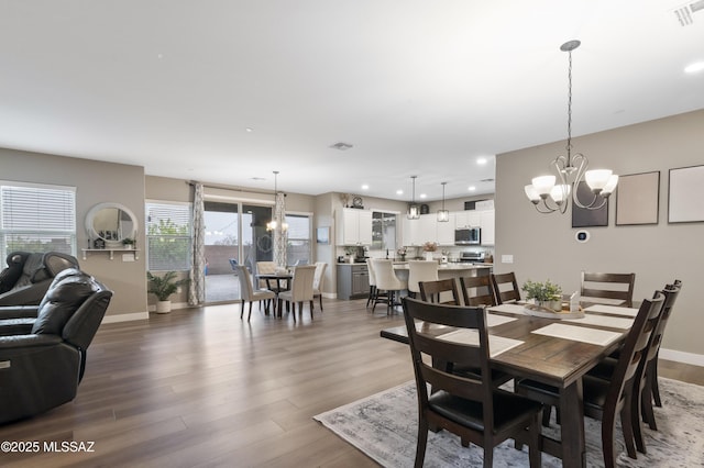 3443 W Tailfeather Dr, Marana, AZ 85658 - dining space featuring a chandelier, wood finished floors, recessed lighting, and baseboards