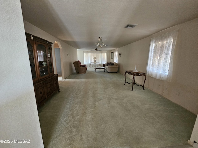 1760 W Airport Rd, Willcox, AZ 85643 - living area featuring ceiling fan, carpet flooring, and arched walkways