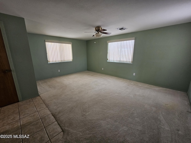 1760 W Airport Rd, Willcox, AZ 85643 - tiled spare room featuring ceiling fan and carpet flooring