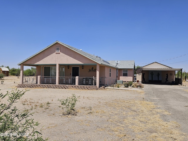 1760 W Airport Rd, Willcox, AZ 85643 - view of front facade featuring gravel driveway, a carport, and stucco siding