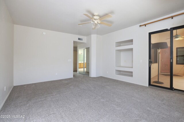 1265 Quail Point Ct, Tucson, AZ 85745 - carpeted spare room with ceiling fan and built in features