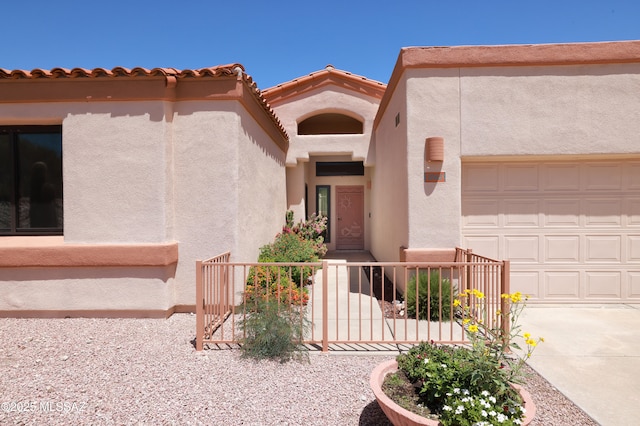 1265 Quail Point Ct, Tucson, AZ 85745 - entrance to property with an attached garage, stucco siding, and concrete driveway