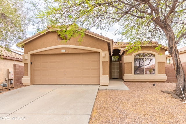 4161 W Diamond Butte Ct, Tucson, AZ 85745 - mediterranean / spanish home with stucco siding, a tiled roof, driveway, and an attached garage