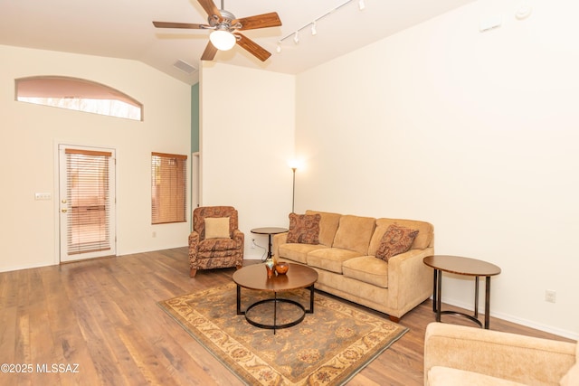 4161 W Diamond Butte Ct, Tucson, AZ 85745 - living room featuring track lighting, vaulted ceiling, wood finished floors, a ceiling fan, and baseboards