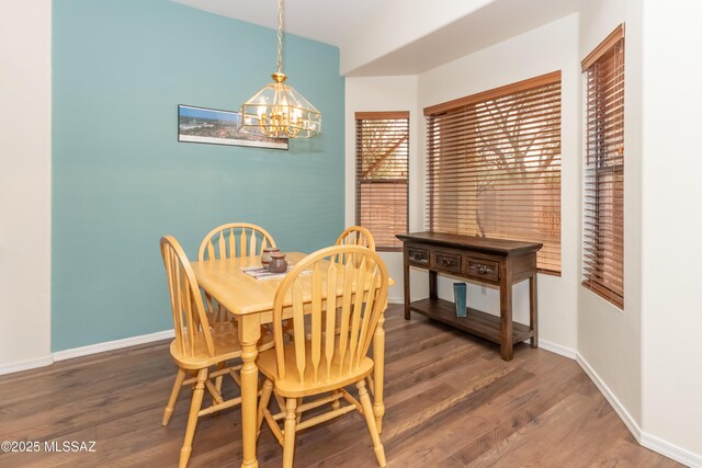 4161 W Diamond Butte Ct, Tucson, AZ 85745 - dining area with a chandelier, wood finished floors, and baseboards