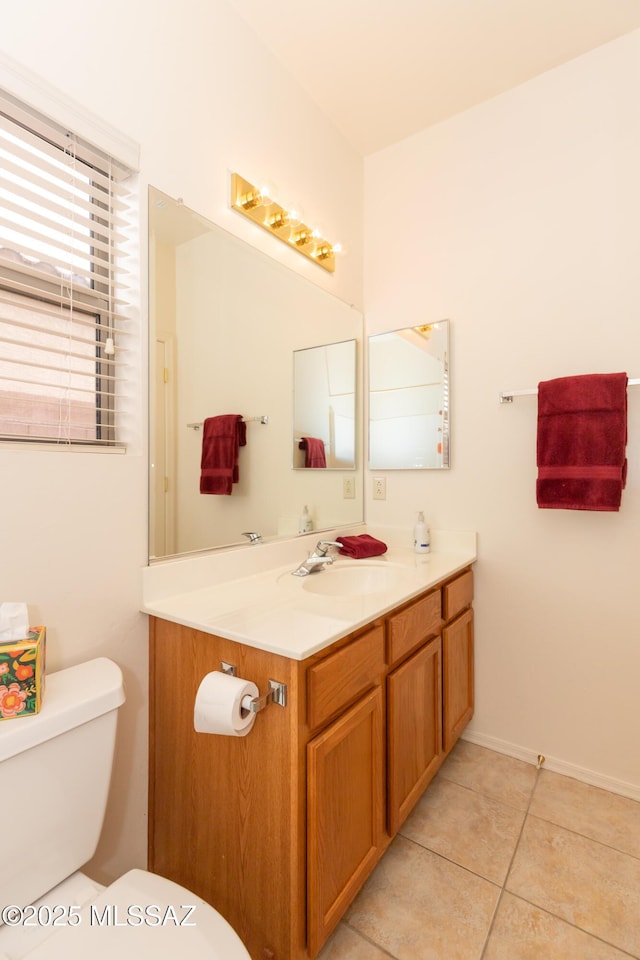 4161 W Diamond Butte Ct, Tucson, AZ 85745 - half bath featuring toilet, vanity, tile patterned flooring, and baseboards