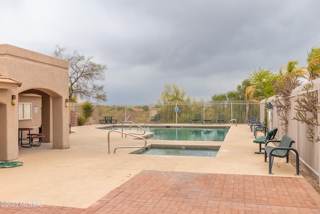 4161 W Diamond Butte Ct, Tucson, AZ 85745 - community pool with a community hot tub, a fenced backyard, and a patio
