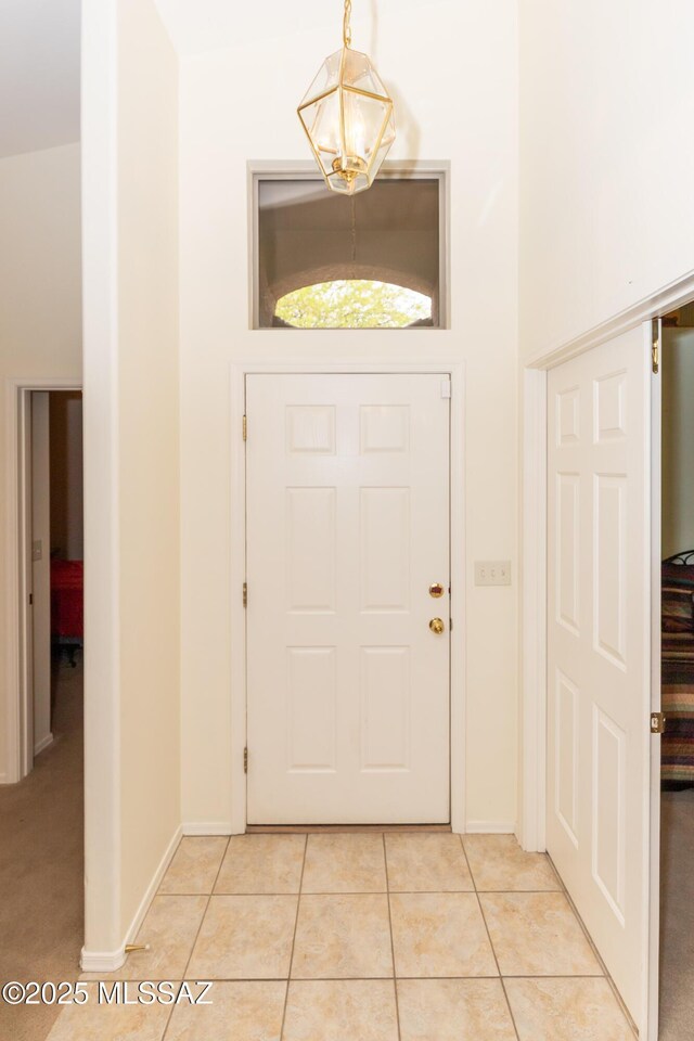 4161 W Diamond Butte Ct, Tucson, AZ 85745 - entryway with light tile patterned floors and baseboards