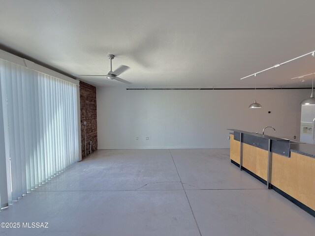 1001 E 17th St Apt 106, Tucson, AZ 85719 - spare room with concrete floors and a ceiling fan