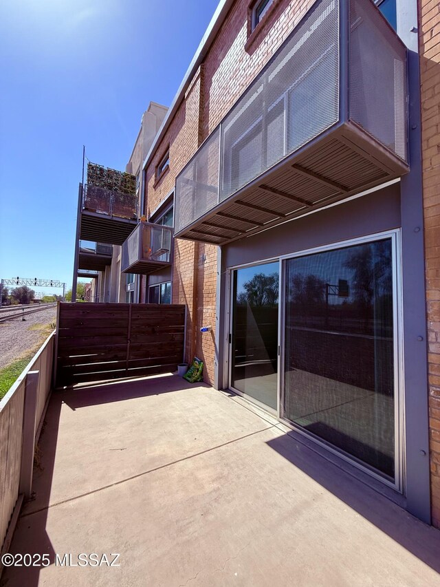 1001 E 17th St Apt 106, Tucson, AZ 85719 - view of patio featuring fence