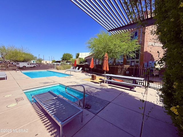 1001 E 17th St Apt 106, Tucson, AZ 85719 - community pool featuring a patio area and fence