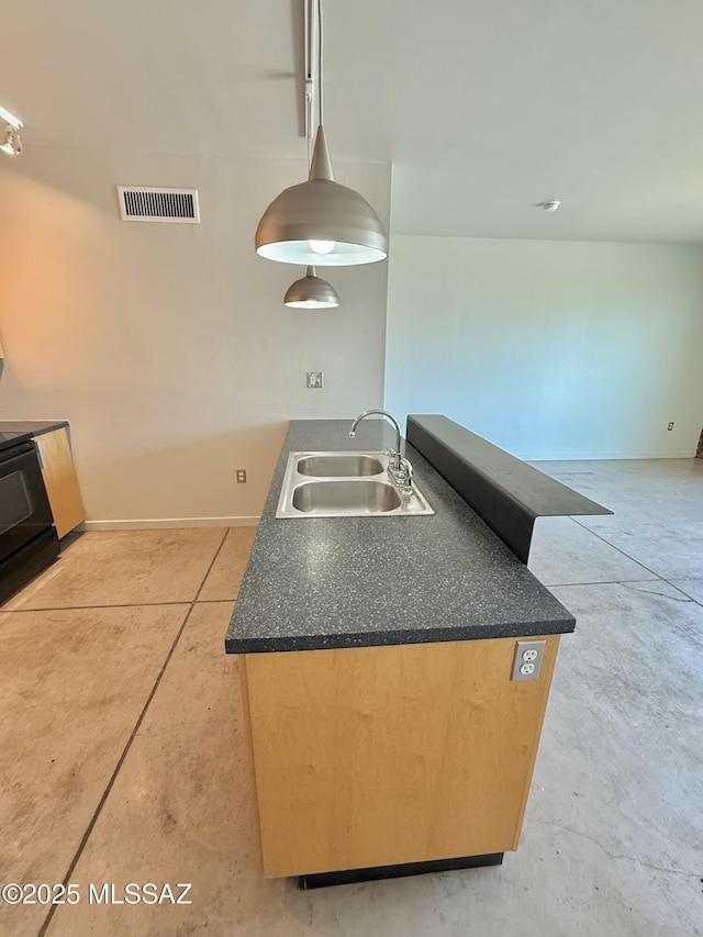 1001 E 17th St Apt 106, Tucson, AZ 85719 - kitchen featuring a sink, dark countertops, and black range with electric cooktop