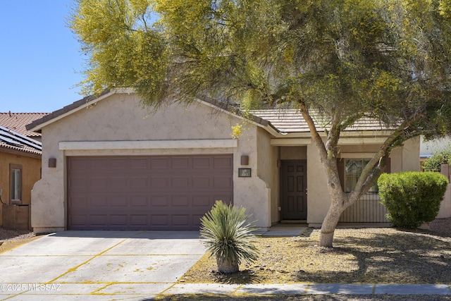 803 W Calle Muro Fuerte Dr, Sahuarita, AZ 85629 - view of front of home featuring stucco siding, concrete driveway, and a garage
