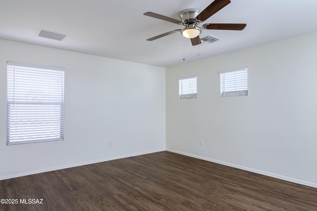 803 W Calle Muro Fuerte Dr, Sahuarita, AZ 85629 - empty room featuring dark wood-style floors, a ceiling fan, and baseboards