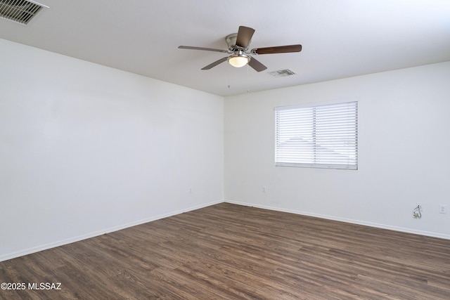 803 W Calle Muro Fuerte Dr, Sahuarita, AZ 85629 - spare room featuring dark wood-style floors, ceiling fan, and baseboards