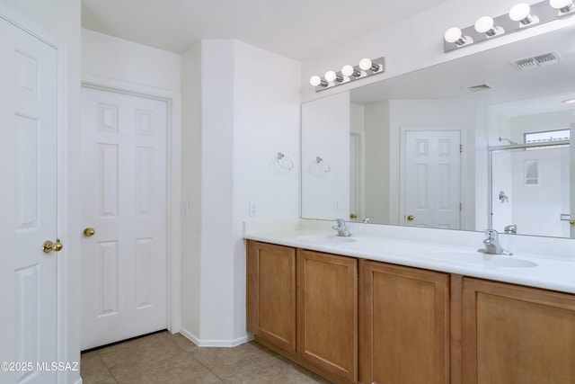803 W Calle Muro Fuerte Dr, Sahuarita, AZ 85629 - bathroom with tile patterned flooring, double vanity, baseboards, and a shower with door