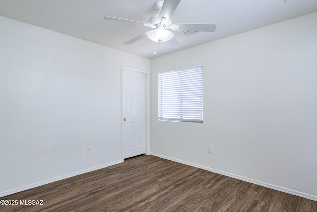 803 W Calle Muro Fuerte Dr, Sahuarita, AZ 85629 - spare room featuring dark wood-style floors, baseboards, and ceiling fan