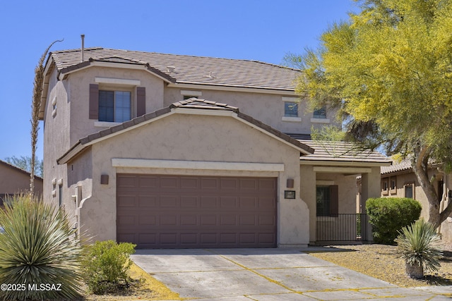 803 W Calle Muro Fuerte Dr, Sahuarita, AZ 85629 - traditional home featuring stucco siding, a tile roof, driveway, and a garage