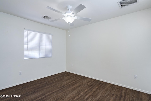 803 W Calle Muro Fuerte Dr, Sahuarita, AZ 85629 - empty room with dark wood finished floors, baseboards, and ceiling fan