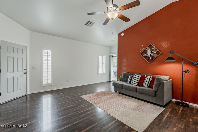 living area with lofted ceiling, ceiling fan, wood finished floors, and baseboards