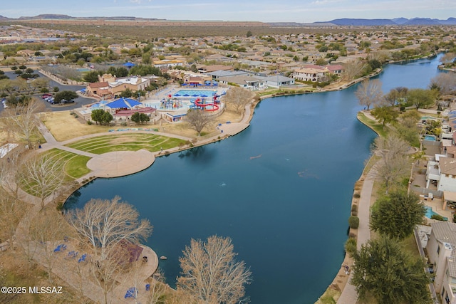 aerial view of property's location featuring a water and mountain view
