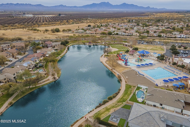 aerial view of property's location with a water and mountain view