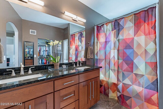 4296 N Rillito Creek Pl, Tucson, AZ 85719 - full bath with double vanity and a shower with curtain