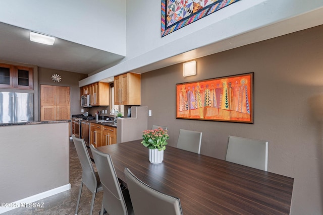 4296 N Rillito Creek Pl, Tucson, AZ 85719 - dining space with baseboards