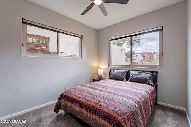 4296 N Rillito Creek Pl, Tucson, AZ 85719 - carpeted bedroom with baseboards and a ceiling fan