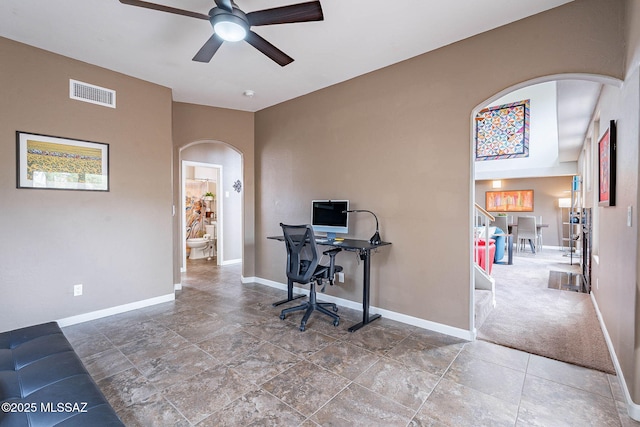 4296 N Rillito Creek Pl, Tucson, AZ 85719 - office area with arched walkways, a ceiling fan, and baseboards