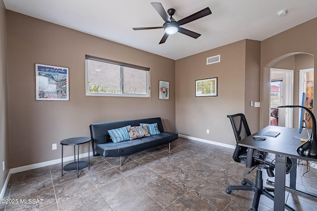 4296 N Rillito Creek Pl, Tucson, AZ 85719 - office area featuring baseboards, plenty of natural light, and stone finish floors