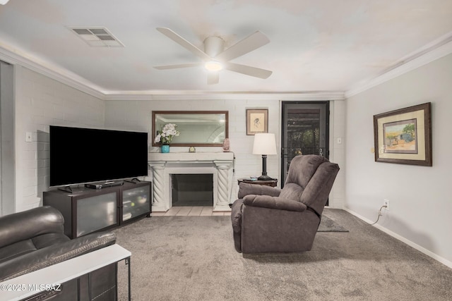 8360 E Mary Dr, Tucson, AZ 85730 - carpeted living area featuring crown molding, a glass covered fireplace, a ceiling fan, and baseboards