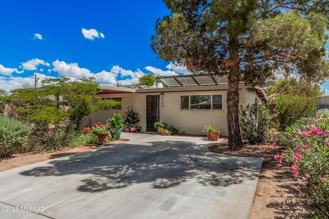 8360 E Mary Dr, Tucson, AZ 85730 - view of front of house with metal roof