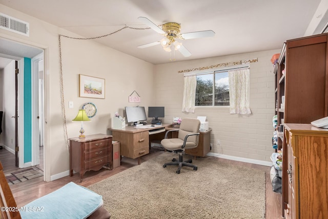 8360 E Mary Dr, Tucson, AZ 85730 - home office featuring light wood-type flooring, ceiling fan, and baseboards