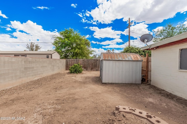8360 E Mary Dr, Tucson, AZ 85730 - fenced backyard featuring a shed and an outdoor structure