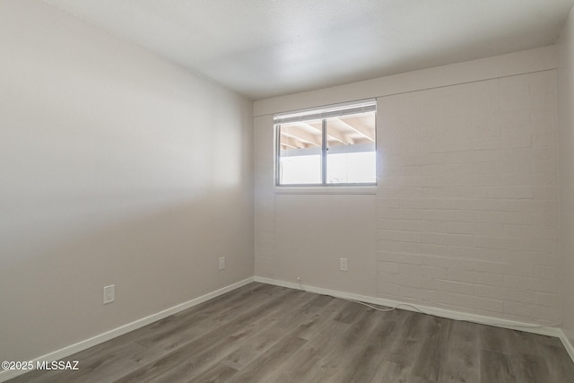 6664 E Mary Dr, Tucson, AZ 85730 - unfurnished room with wood finished floors and baseboards