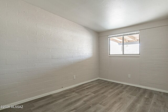 6664 E Mary Dr, Tucson, AZ 85730 - unfurnished room featuring wood finished floors and baseboards
