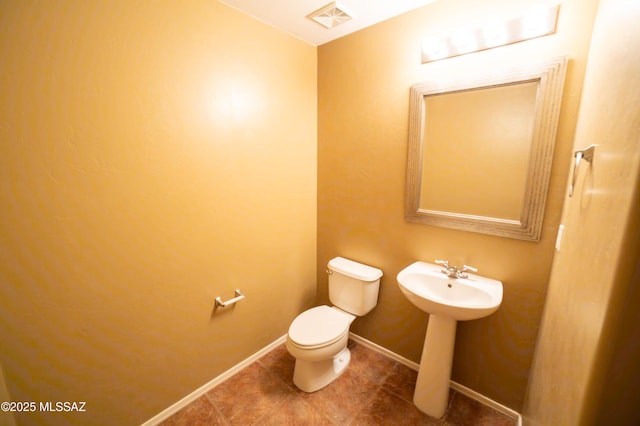 14333 S Camino Vallado, Sahuarita, AZ 85629 - half bathroom with toilet, tile patterned flooring, and baseboards