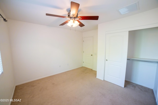 14333 S Camino Vallado, Sahuarita, AZ 85629 - unfurnished bedroom featuring light colored carpet, a closet, baseboards, and a ceiling fan
