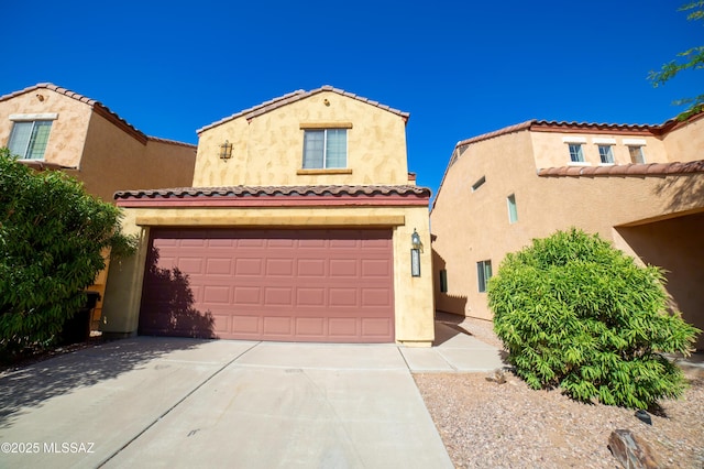 14333 S Camino Vallado, Sahuarita, AZ 85629 - mediterranean / spanish-style house with stucco siding, concrete driveway, a garage, and a tiled roof