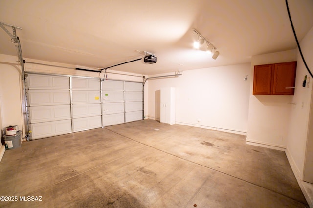 14333 S Camino Vallado, Sahuarita, AZ 85629 - garage with a garage door opener and baseboards