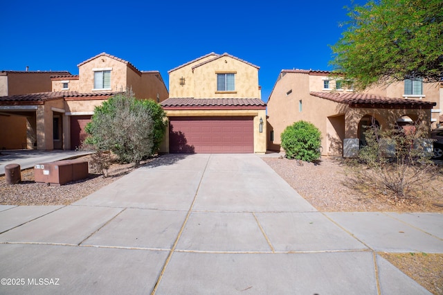 14333 S Camino Vallado, Sahuarita, AZ 85629 - mediterranean / spanish house featuring an attached garage, driveway, stucco siding, and a tiled roof